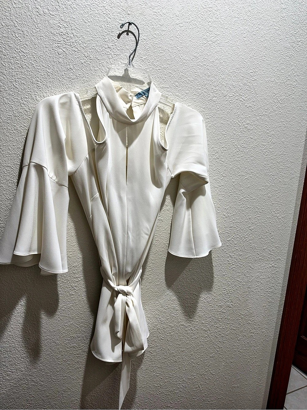 Beautiful collared neckline blouse, cut out shoulders, long sleeves with cuffs.